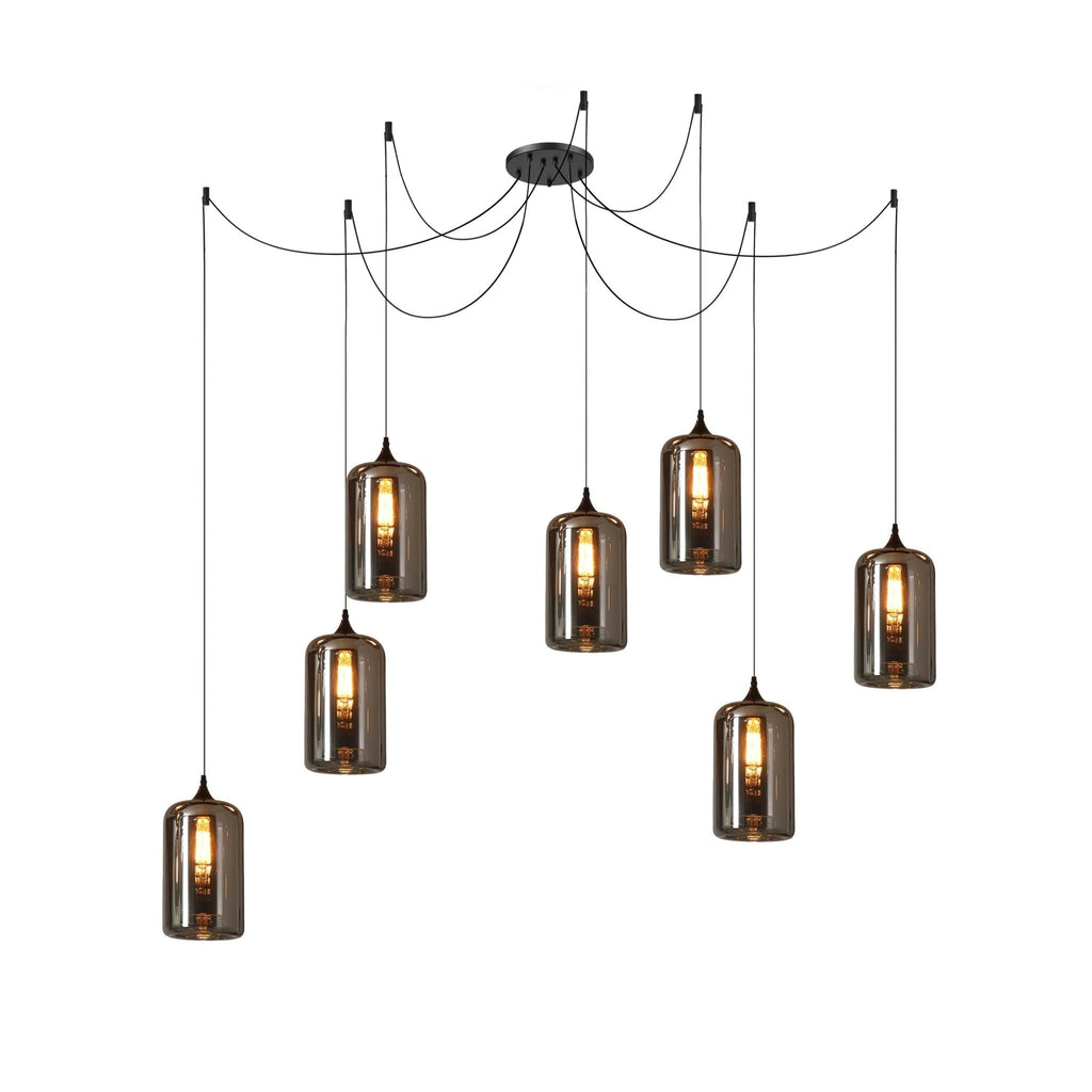 Seven cylindrical Clérachic smoked glass pendants in a spider arrangement, each lit by a long filament bulb.
