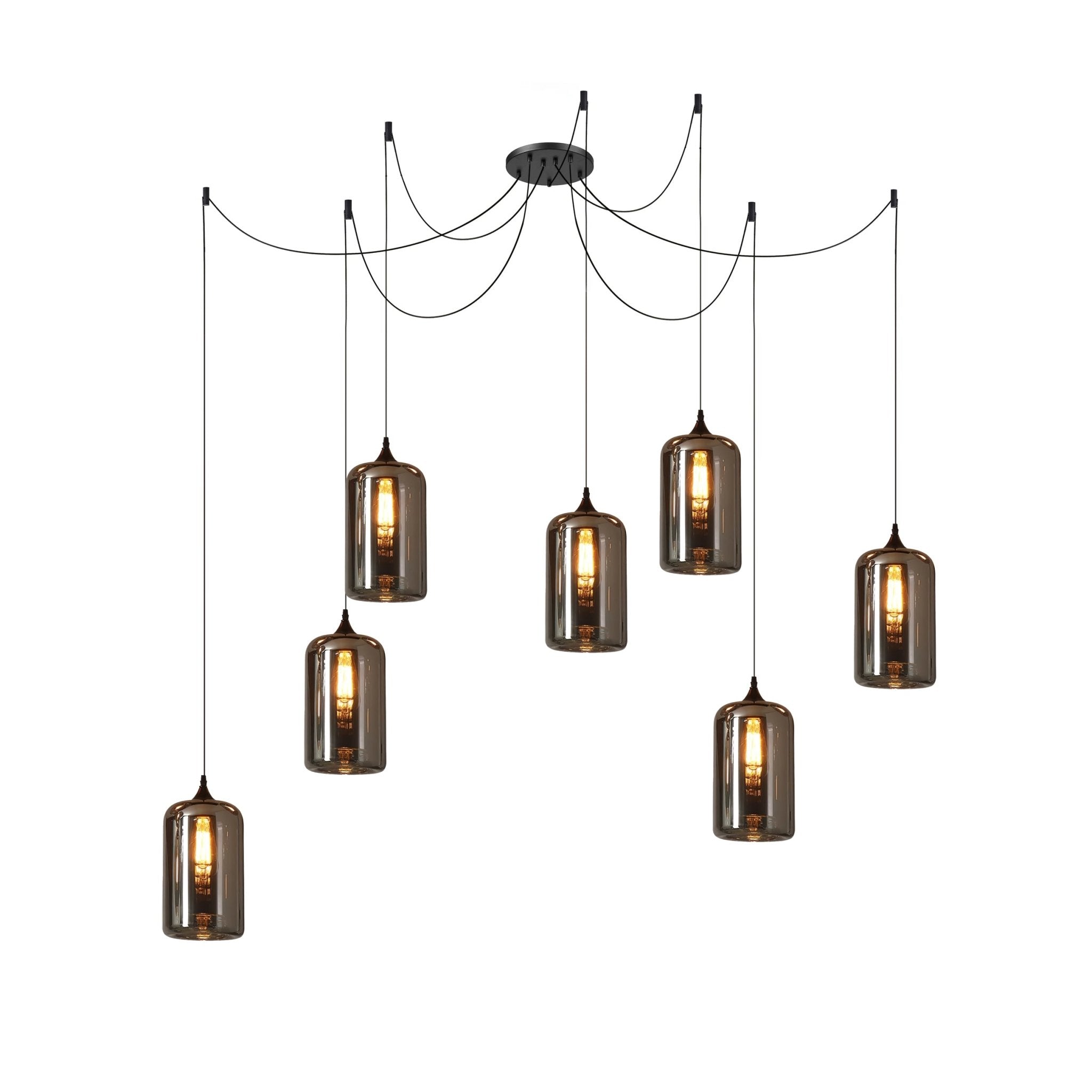 Seven cylindrical Clérachic smoked glass pendants in a spider arrangement, each lit by a long filament bulb.