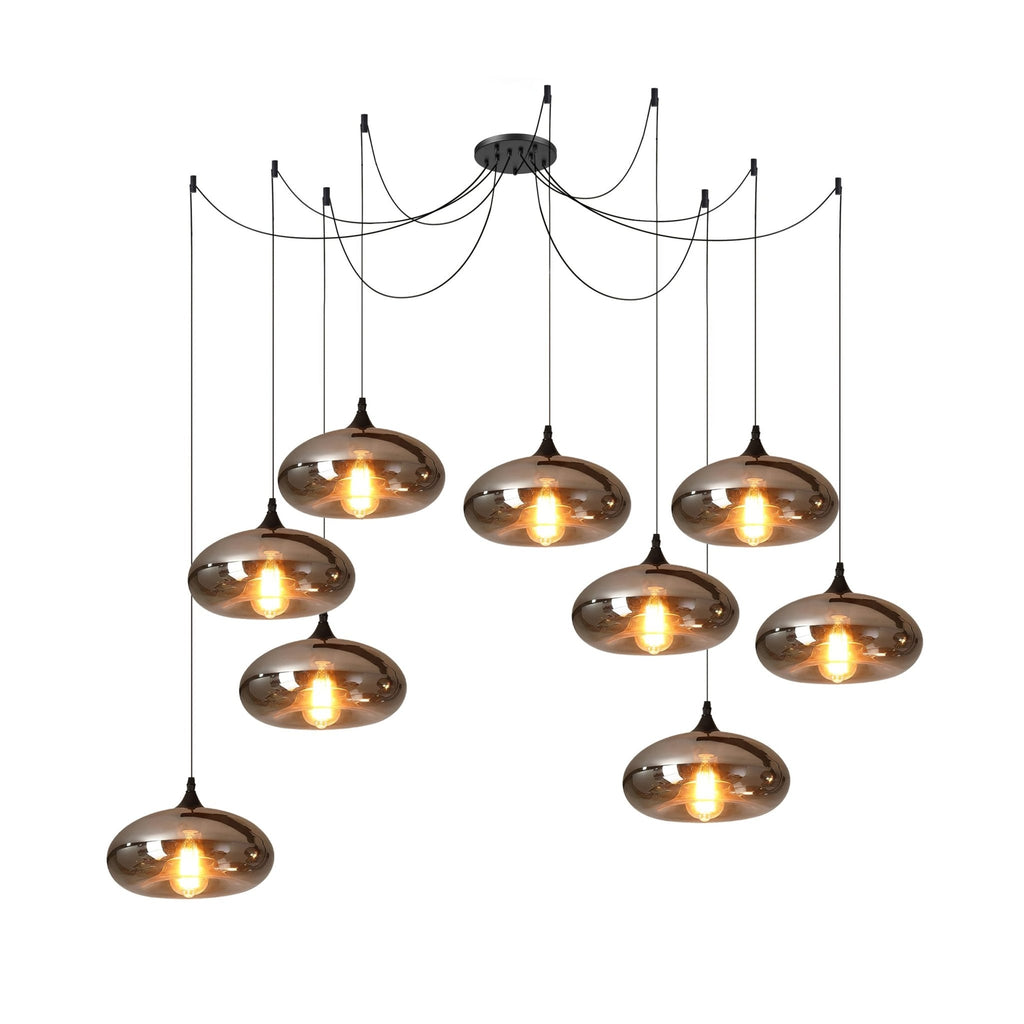 Nine flattened disc Clérachic smoked glass pendants on a nine-cord canopy, filling a wide ceiling area.