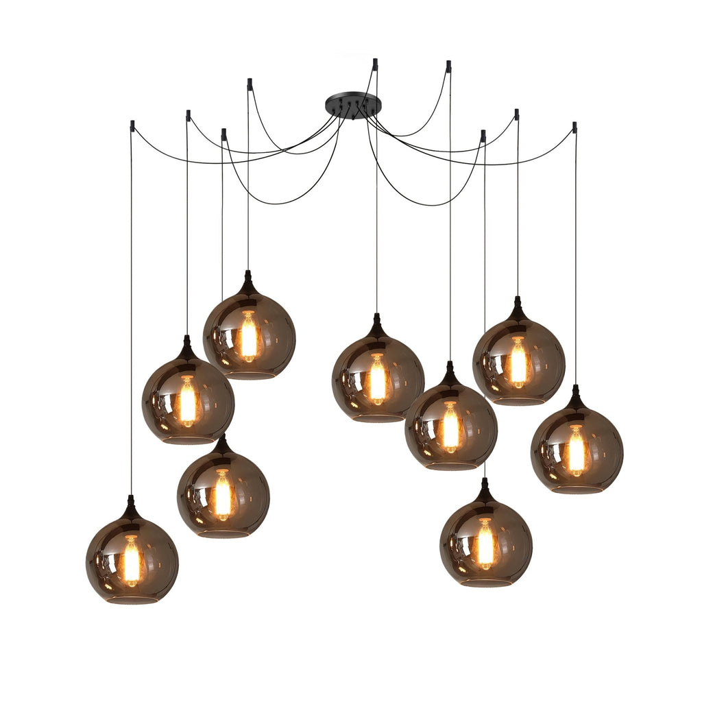 Nine globe Clérachic smoked glass pendants on one canopy, hung at mixed heights and all lit.