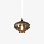 Single onion-shaped Clérachic smoked glass pendant on a plain background, warm filament bulb inside.