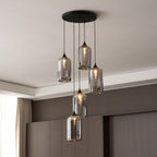 Round black canopy carrying five Clérachic smoked glass cylinders beside a curtained window.