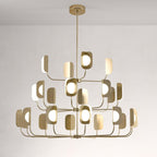 A brass-toned Clérachic chandelier on a central rod, its three tiers of curved arms each ending in a leaf-shaped shade and an opal globe.