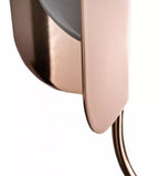 Close view of a copper leaf shade with a gently curved lip and a slim arm, on a white backdrop, part of this Clérachic chandelier family.