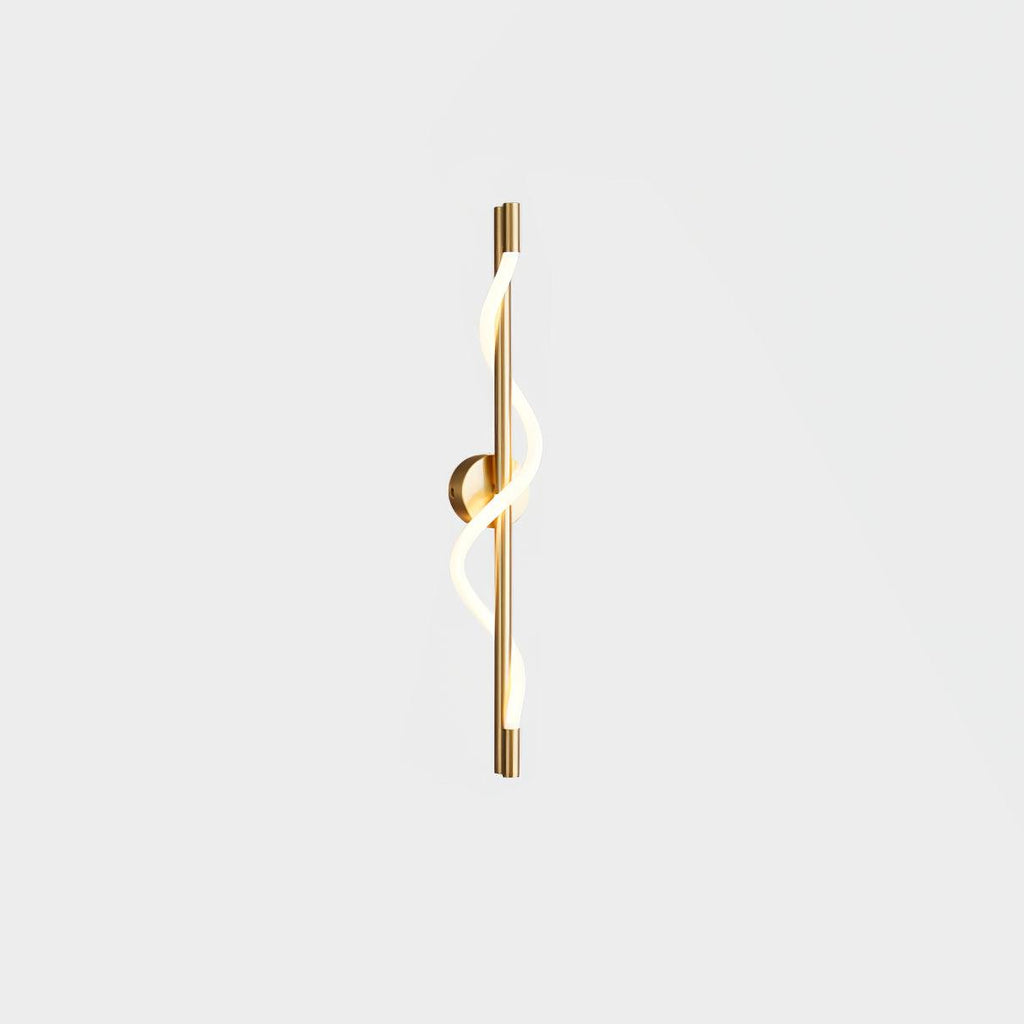 Brass Clérachic wall light with a lit spiral band and a round backplate, shown on a white backdrop.