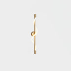 Brass Clérachic wall light with a lit spiral band and a round backplate, shown on a white backdrop.