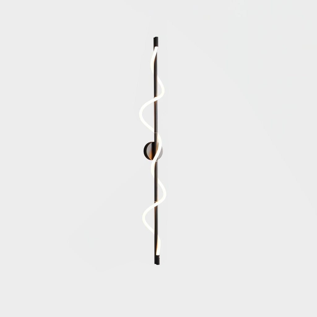 A long black Clérachic wall light with a two-turn lit spiral band and a round backplate, on a pale backdrop.