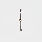 A black Clérachic wall light with a lit spiral band wrapping a slim rod, shown close to its round backplate on white.