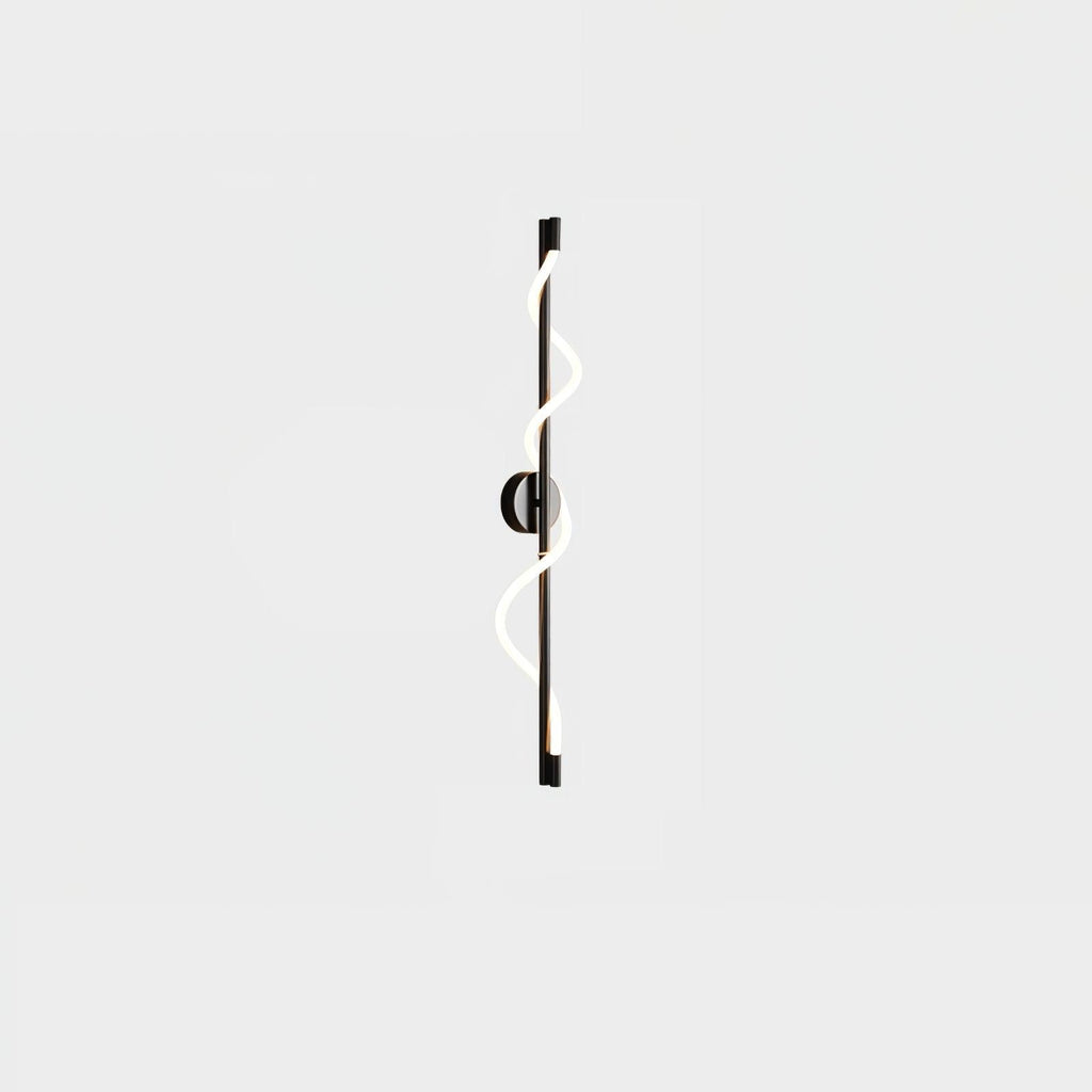 A small view of a black Clérachic wall light with a lit spiral band and a round backplate on a pale backdrop.