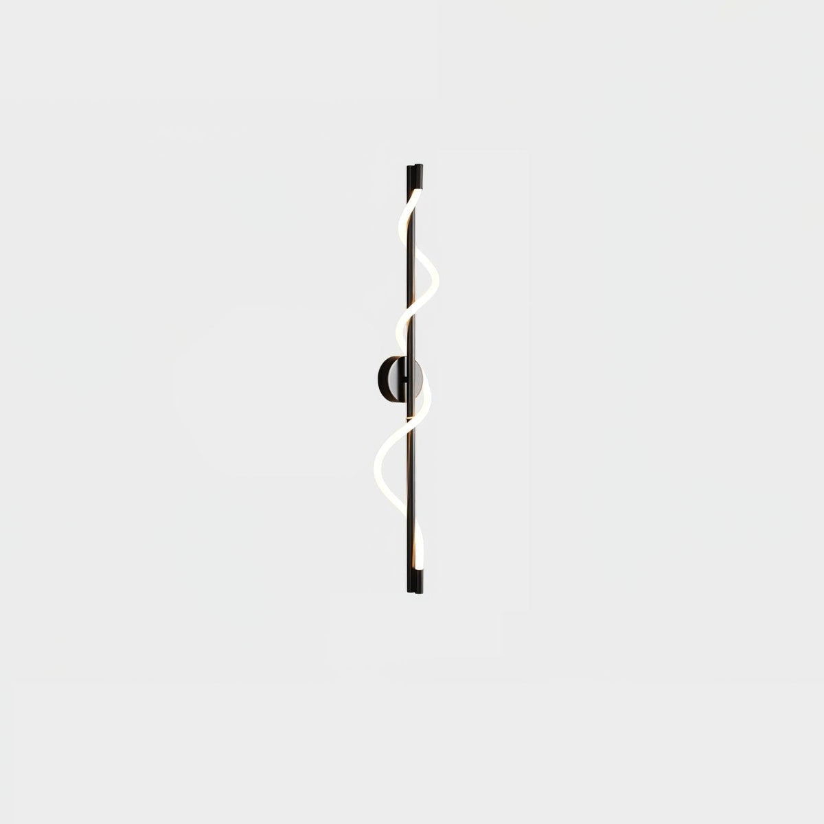 A small view of a black Clérachic wall light with a lit spiral band and a round backplate on a pale backdrop.