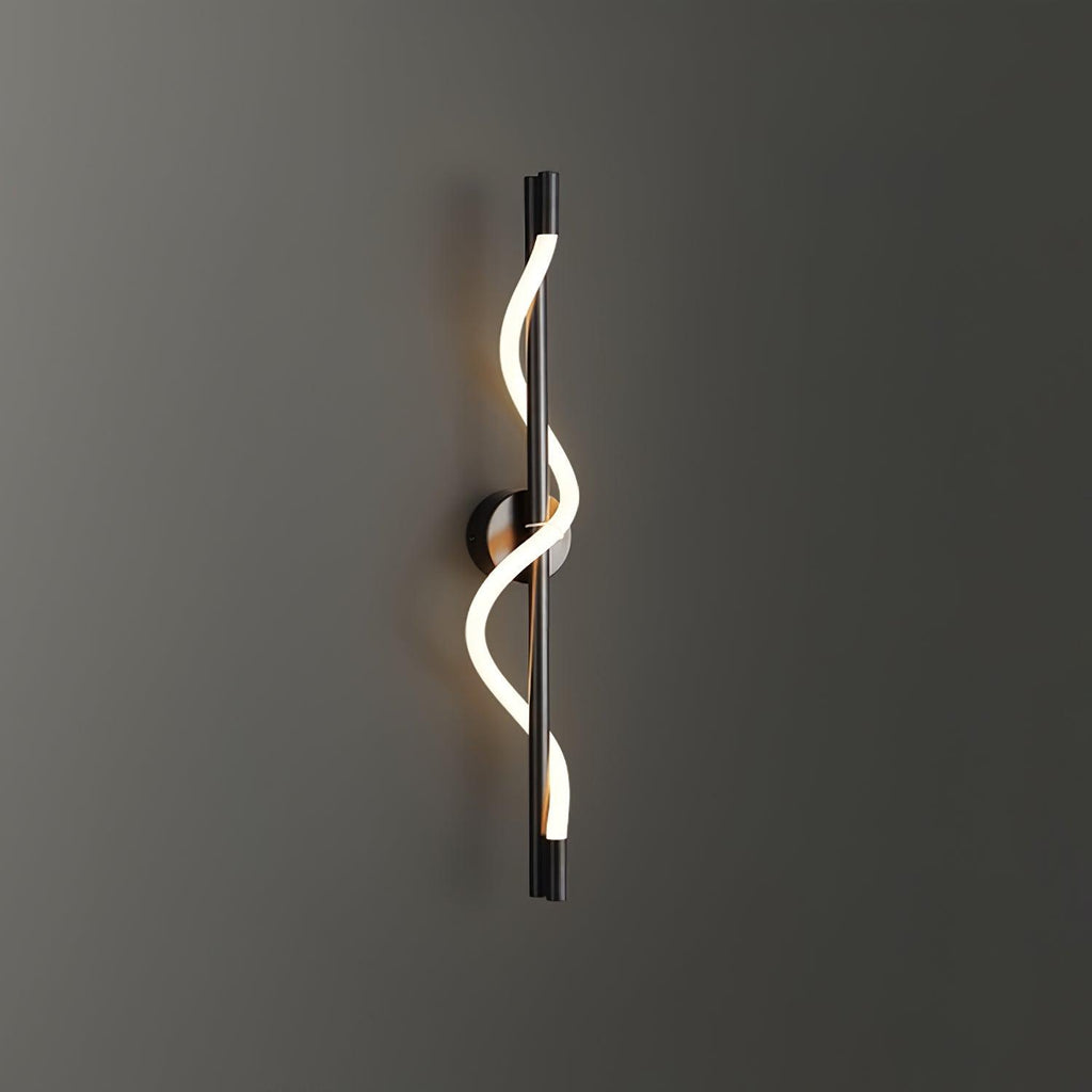 Mounted on a dark grey wall, a black Clérachic wall light with a lit spiral band wrapping its rod.
