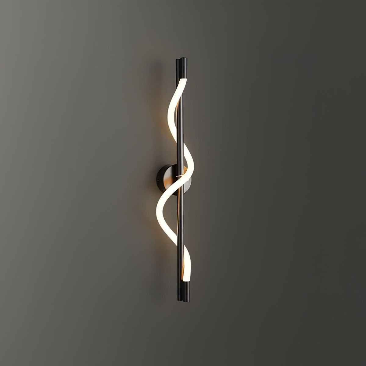 Mounted on a dark grey wall, a black Clérachic wall light with a lit spiral band wrapping its rod.