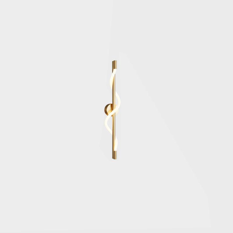 A small brass Clérachic wall light with a lit spiral band and a round backplate, on a plain pale backdrop.