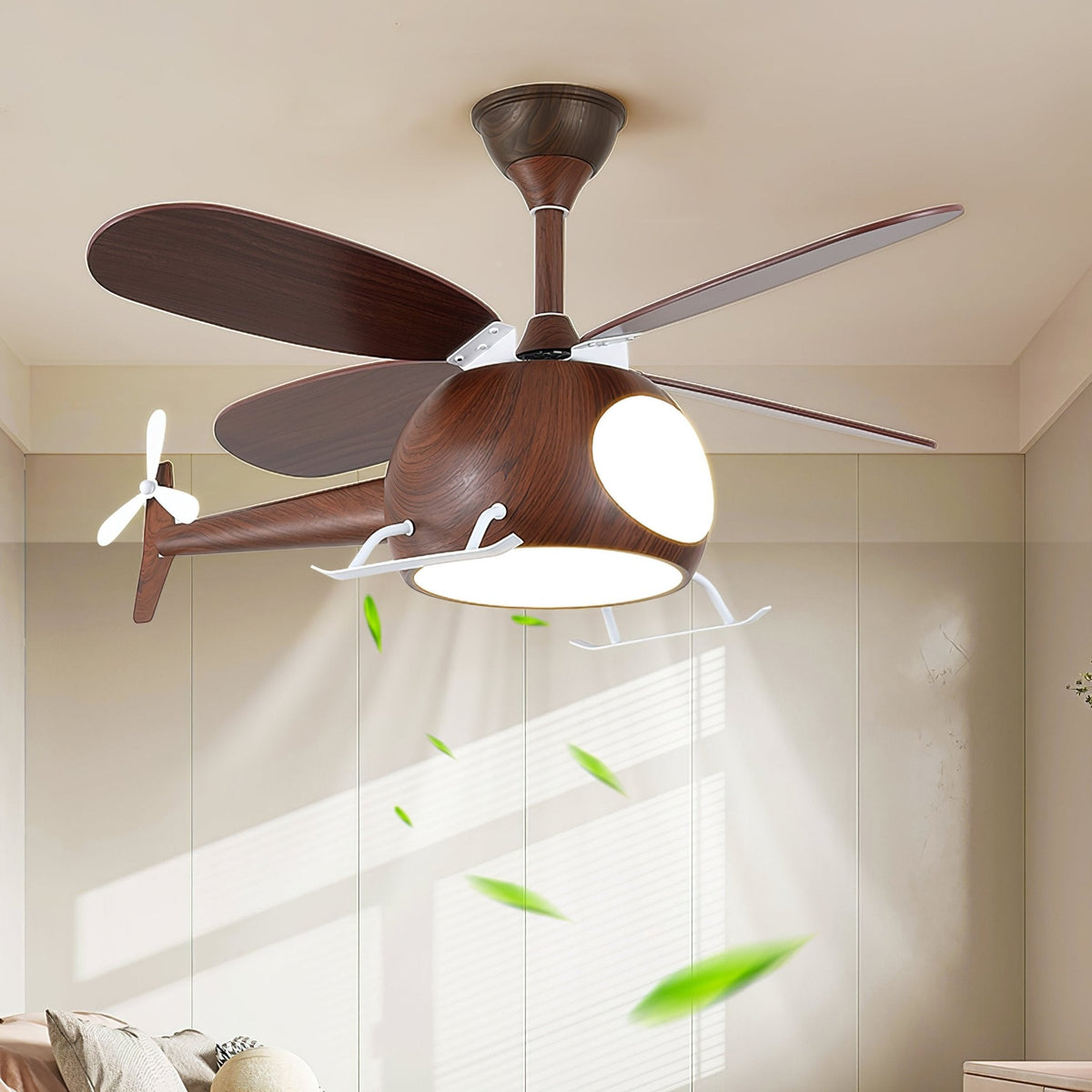 Dark walnut-toned helicopter ceiling fan from Clérachic with its light on, with leaves in the airflow and a pale wardrobe wall behind.