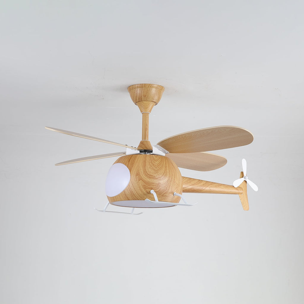 On a light grey ceiling, this wood-grain Clérachic helicopter fan has its cabin light on and white landing skids below.