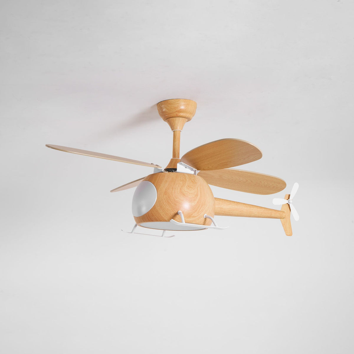 With its cabin light off, this wood-grain Clérachic helicopter fan hangs on a pale grey ceiling, tail rotor to the right.