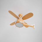 The Clérachic helicopter fan seen from below with the round light panel off, showing four wood-grain blades and the tail rotor.