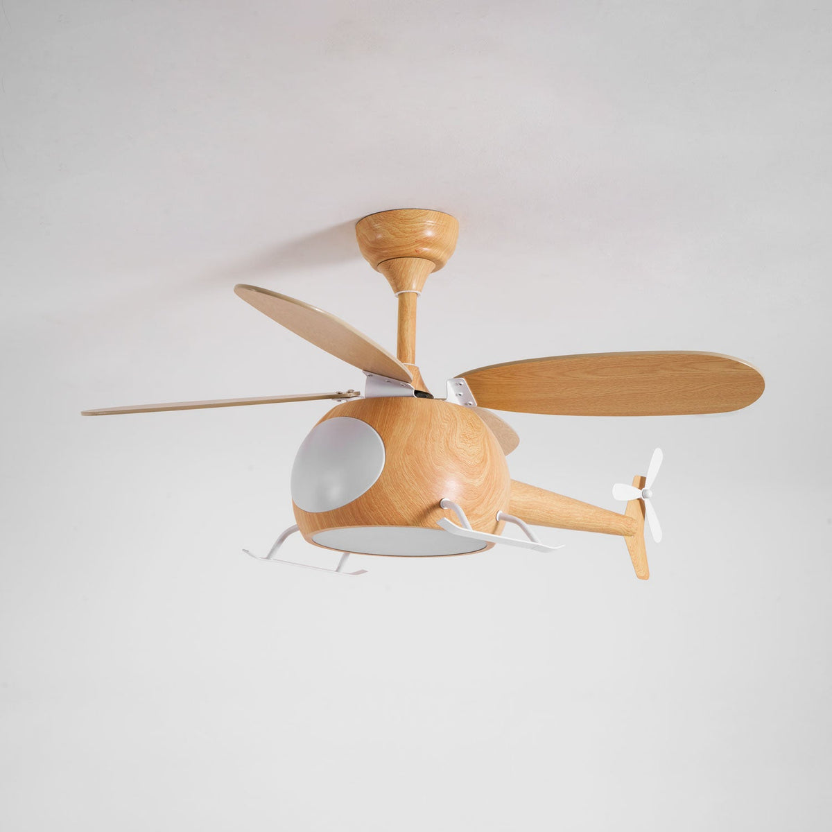 At an angle, a wood-grain Clérachic helicopter fan with its cabin light off and one blade pointing sideways.