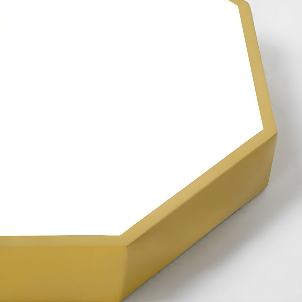 Close-up of the golden-yellow Clérachic hexagon ceiling light's beveled frame edge and acrylic diffuser panel.