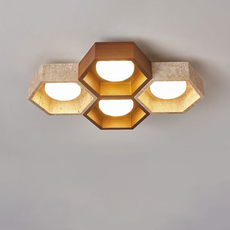 Walnut-toned hexagon at the top of this Clérachic ceiling light, flanked by travertine cells and a second dark cell below.
