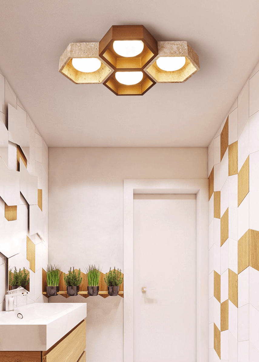 Four-cell Clérachic ceiling light in a small washroom with a white basin, herb planters and gold-and-white wall tiles.