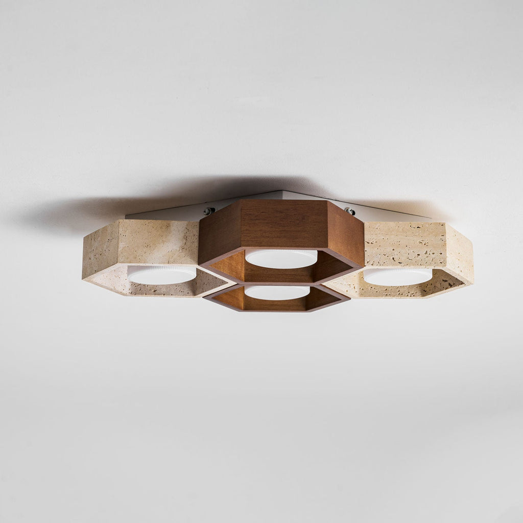 Side-on view of this Clérachic ceiling light showing how shallow the walnut and travertine hexagons sit against the ceiling.