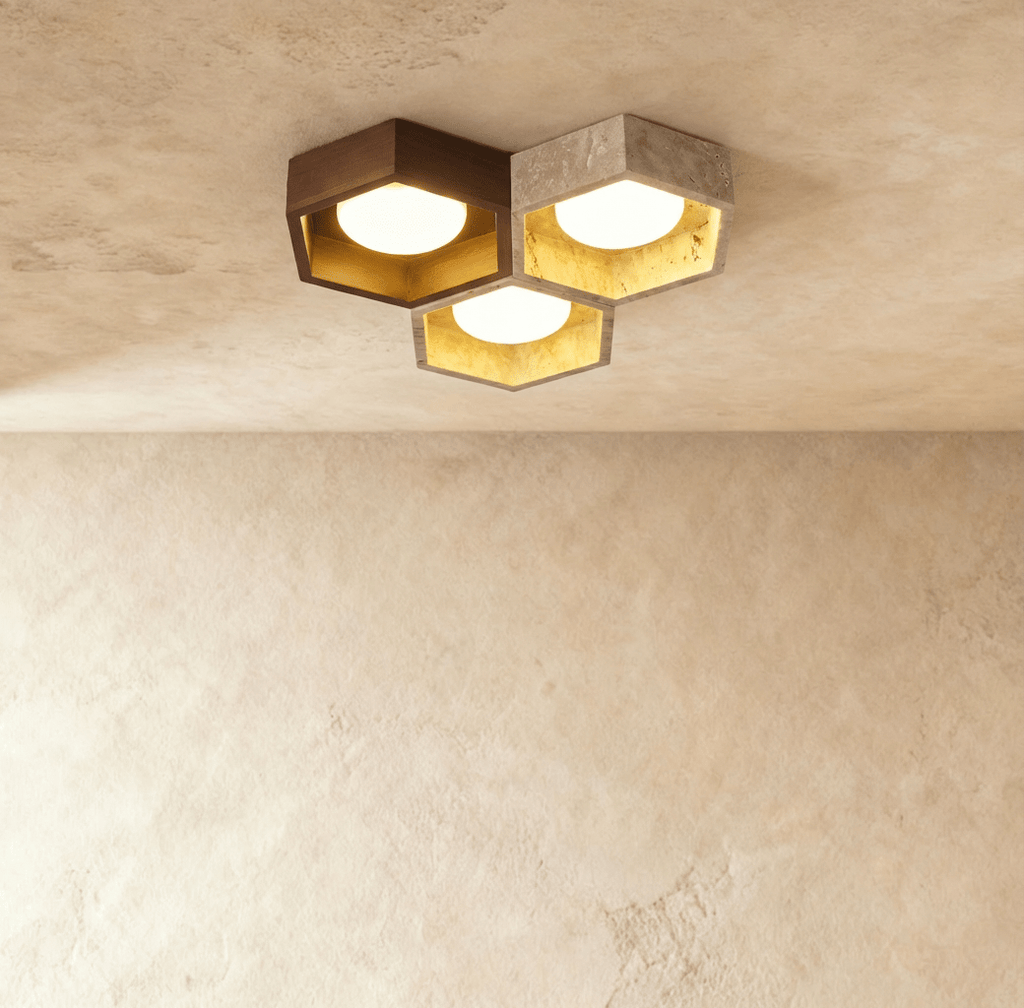 Clérachic ceiling light of three hexagonal walnut and travertine frames, each with a gold-leaf interior and a lit opal glass globe.