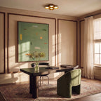 Clérachic four-head hexagonal ceiling light above a dark wood desk and green armchair in a panelled room with a large painting.