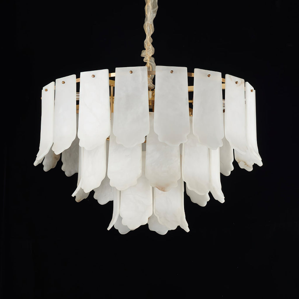 Studio shot on black of the Clérachic Hue Alabaster Chandelier, showing the scalloped hems and amber seams of each stone plate.
