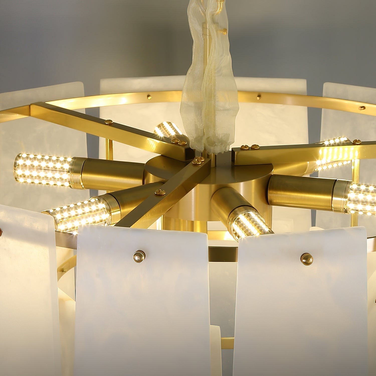 Inside the Clérachic Hue Alabaster Chandelier: the brass spider, its radial arms and the light heads that sit within the drum.