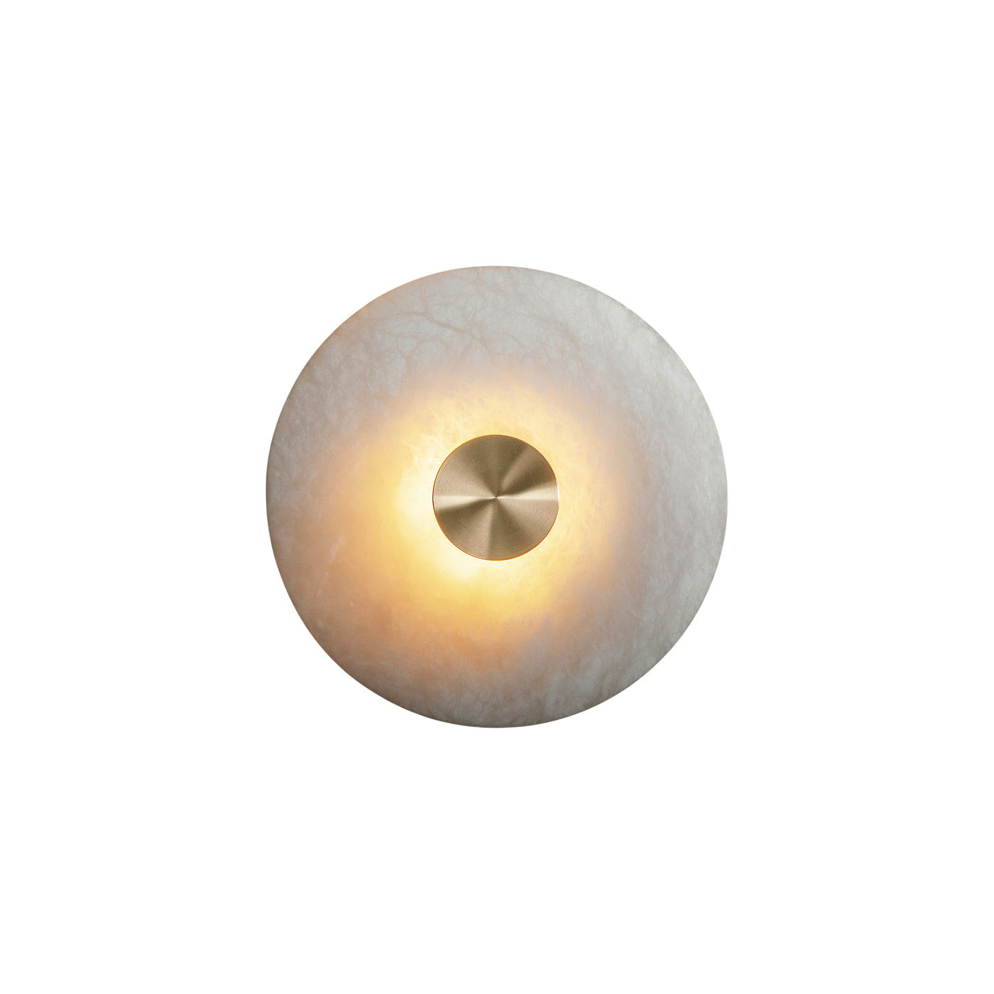 Clérachic alabaster sconce lit against a white studio backdrop, warm light spilling out around the brushed brass hub.