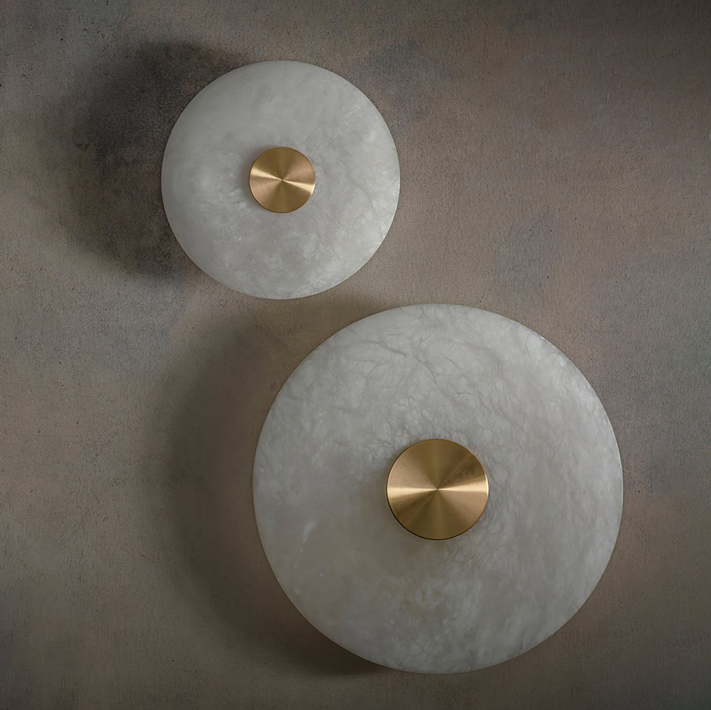 Clérachic sconces in both diameters, off, showing the tonal difference between two natural stone shades.