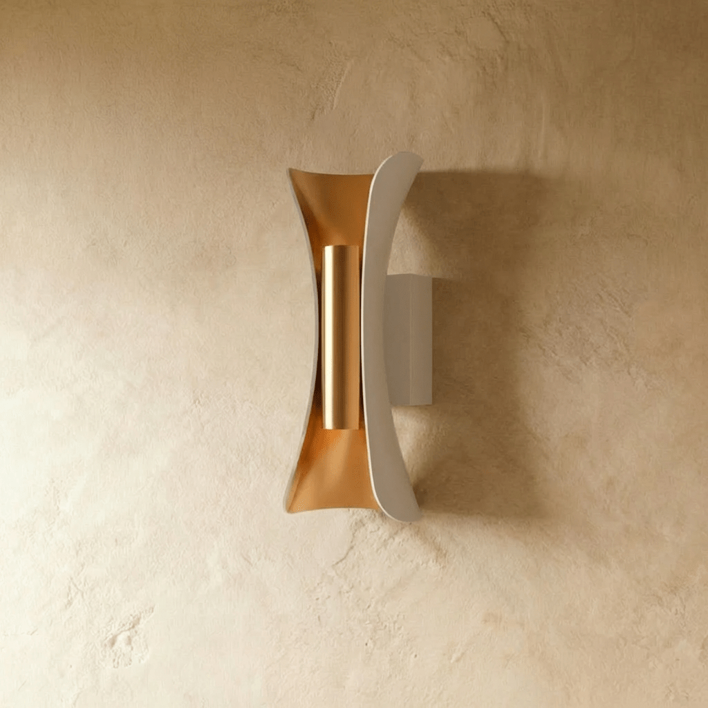 Clérachic white curved metal wall lamp with a gold-toned inner reflector and cylinder, switched off on a plaster wall.