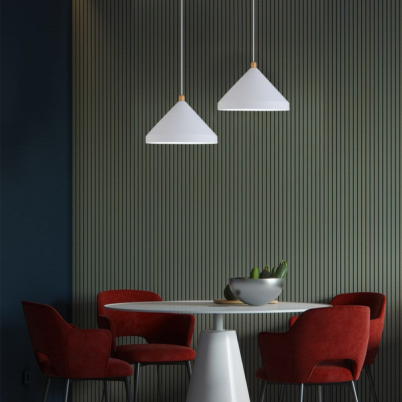 Two Clérachic white 1-light cone pendants hang at staggered heights over a round table and burgundy chairs.