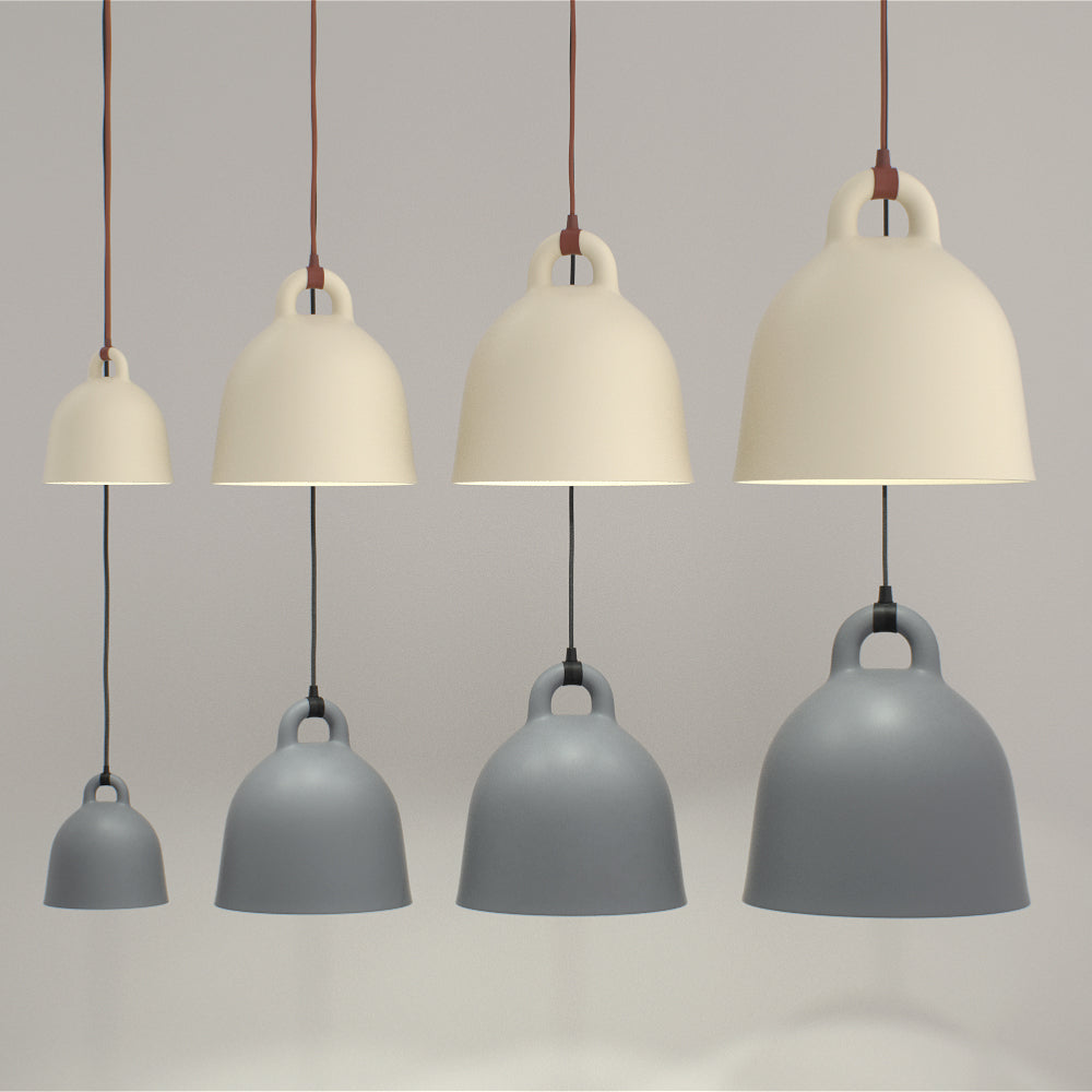 Eight Clérachic bell pendants in four sizes, in sand and grey, hang in two rows on a soft grey backdrop.