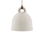 A medium sand-coloured Clérachic bell pendant with a brown cord and loop handle, on a plain white backdrop.