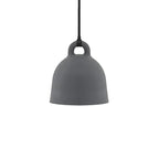 A small grey Clérachic bell pendant with a black cord, shown on a plain white backdrop.