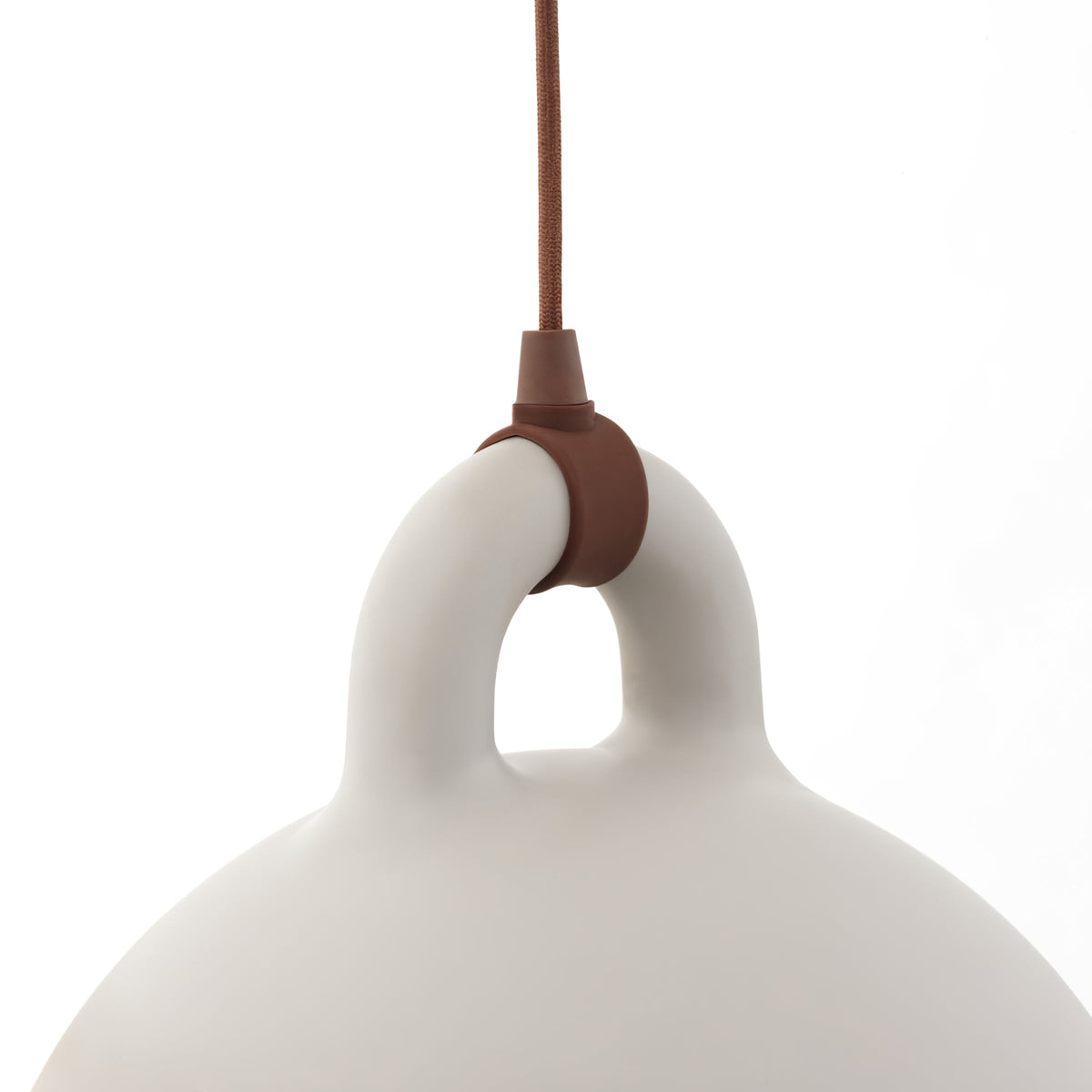 Close view of the brown cord fitting on the loop handle of a sand-coloured Clérachic bell pendant, on white.