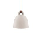 A small sand-coloured Clérachic bell pendant with a brown cord, hanging on a plain white backdrop.
