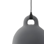 Cropped close view of a grey Clérachic bell pendant's loop handle and curved shoulder, on a plain white backdrop.