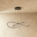 Clérachic black pendant with its LED loops switched off, showing the slim black frame and the three suspension cables.