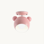 Pink Clérachic iron ceiling lamp with two round ears on a rounded shade, bulb visible inside, on a plain off-white backdrop.