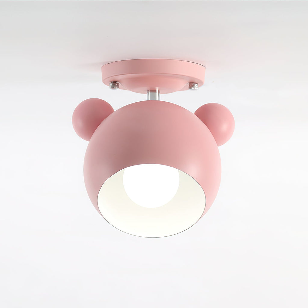 Pink Clérachic ceiling lamp with a bulb visible in its white-lined dome, shown against a pale grey backdrop.