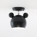 Matt black Clérachic ceiling lamp with round ears, a short stem and a flat black ceiling plate.