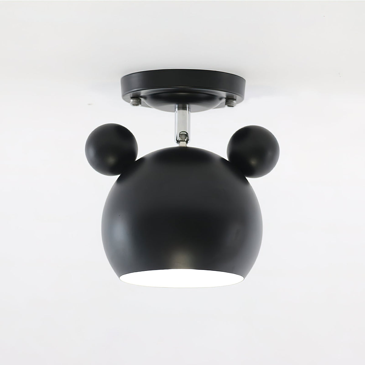 Matt black Clérachic ceiling lamp with round ears, a short stem and a flat black ceiling plate.