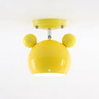 Glossy yellow Clérachic ceiling lamp with round ears and a short stem under a yellow ceiling plate.