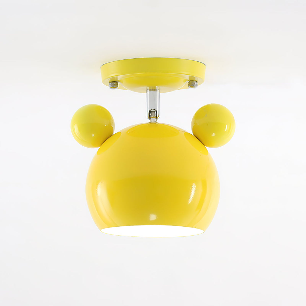 Glossy yellow Clérachic ceiling lamp with round ears and a short stem under a yellow ceiling plate.