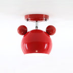 Glossy red Clérachic ceiling lamp with round ears, a short stem and a red ceiling plate on a pale backdrop.