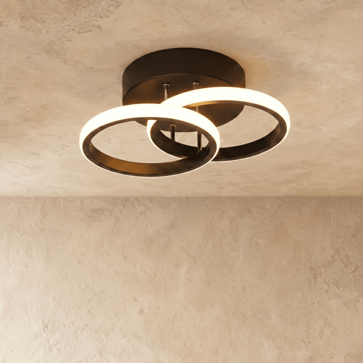 Clérachic black iron ceiling light with two overlapping glowing acrylic rings on a round canopy, flush on limewash plaster.