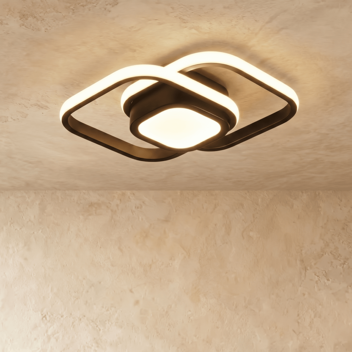 Clérachic black ceiling light with two overlapping rounded-square acrylic loops and a glowing square centre, on plaster.